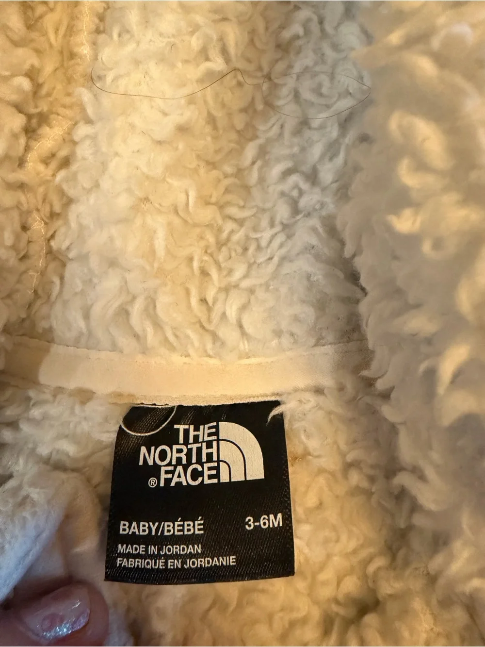 The North Face plush cream